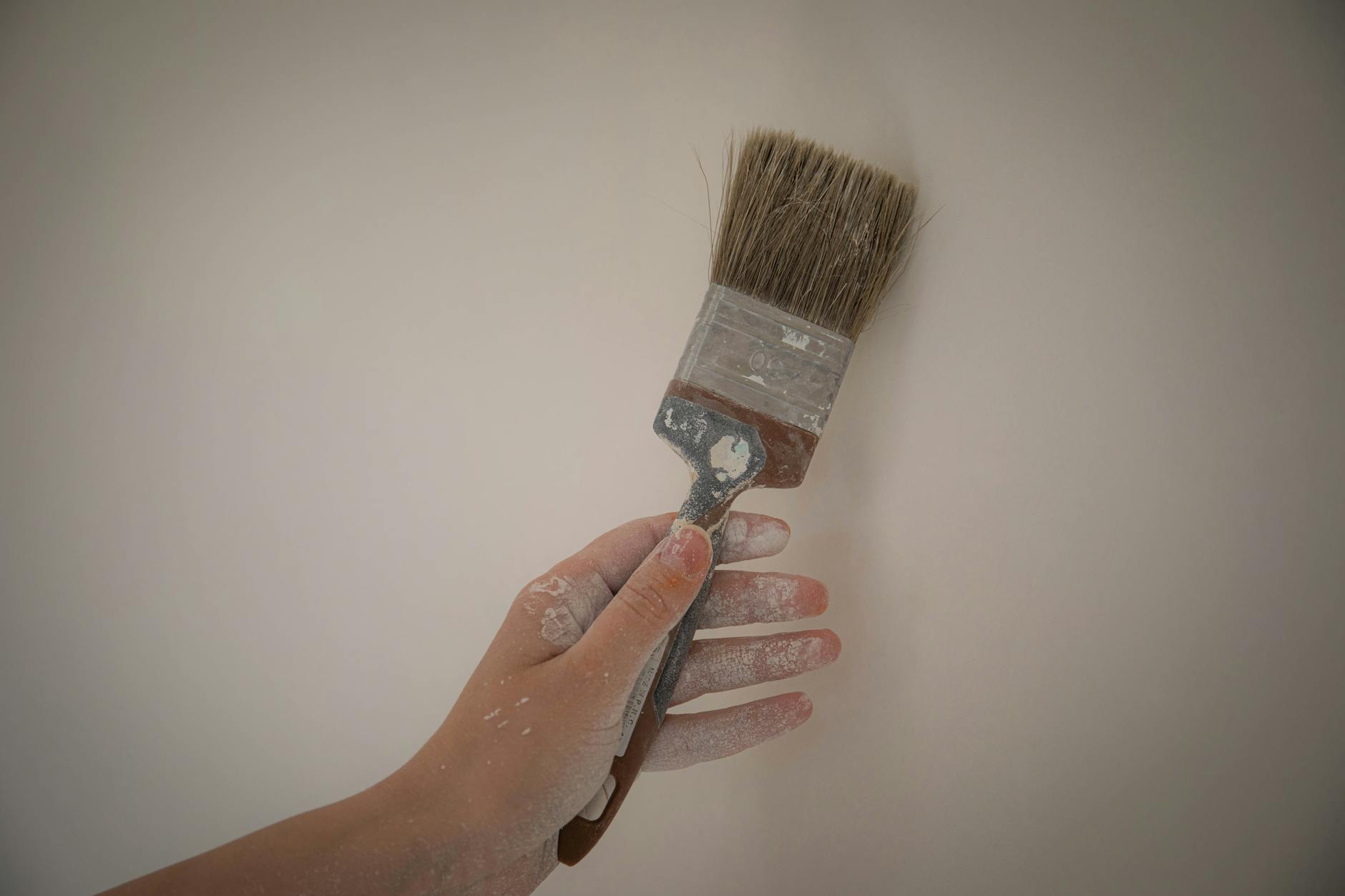 pexels-photo-8481700 - IFixSht A cozy bedroom painted in neutral tones with soft lighting creating a relaxing vibe.
